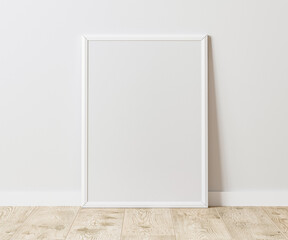 Blank Vertical white frame on wooden floor with white wall, 3:4 ratio, 30x40 cm, 18x24 inches, poster frame mock up, 3d rendering