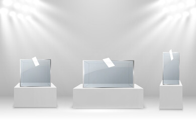 Glass showcase for the exhibition in the form of a cube. Background for sale illuminated by spotlights. Museum glass box isolated advertising or business design boutique. Exhibition hall.