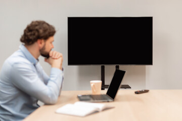 Worker Watching Webinar, Focus On Monitor With Black Empty Screen,