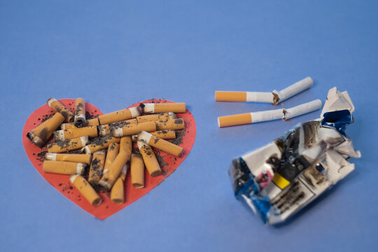 Heart ruined by cigarette smoke, high cholesterol, high blood pressure, heart disease, shortness of breath. Risk of heart attack. Stop smoking day - Powered by Adobe