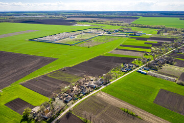 Aerial view to spring landscape with green fields and farming  at Ukraine