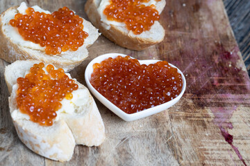 natural red salmon caviar with baguette and butter