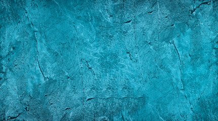 Blue green abstract background. Toned rough rock surface texture. Beautiful teal background with copy space for design. 