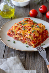 Cannelloni with meat, cheese, tomatoes and thyme. Italian cuisine.