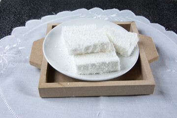 Maria Mole inside a white dish on the table in brazil 