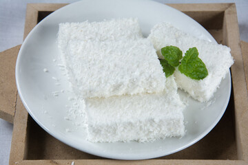 Maria Mole inside a white dish on the table in brazil 