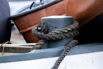 Ship rope on bollards in the harbour