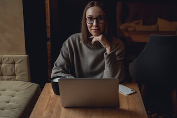 Young beauty woman using laptop in cafe, smartphone, coffee