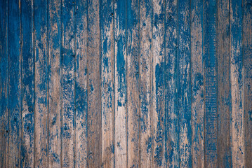 Fototapeta na wymiar Brown natural wood dark background, vintage, with knots and nail holes, wood planks, old painted blue