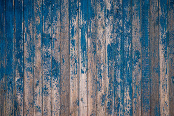 Brown natural wood dark background, vintage, with knots and nail holes, wood planks, old painted blue