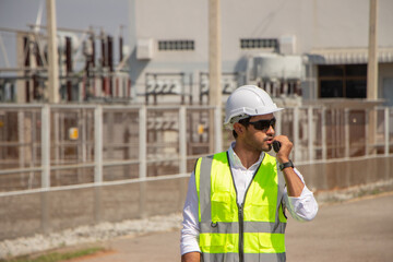 engineer team working in wind turbine farm. Renewable energy with wind generator by alternative energy concept.