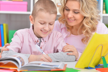 Fototapeta premium Mother and son doing homework