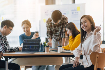 Business women in business conference room while meeting business team for marketing planning.