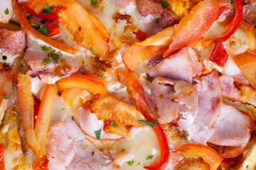 pizza with different ingredients pepper, cheese, sausage and green spices