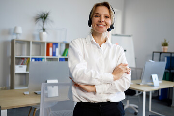 Portrait of smiling female helpline operator in headset