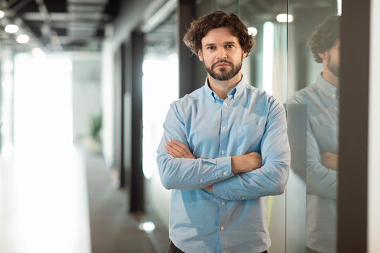 Portrait of business man posing looking at camera