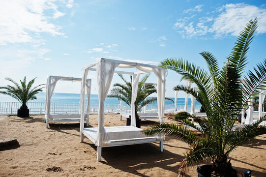 White canopy and curtains at Sunny Beach on Black Sea in Bulgaria. Summer vacation travel holiday.
