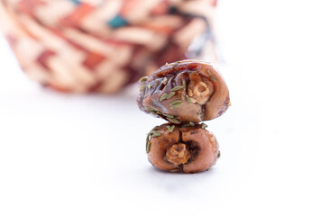 dates in a basket made of palm fronds with a white background in a basket made of palm fronds with a white background- Eid Mubarak - Ramadan