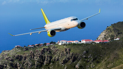 Fototapeta na wymiar White passenger plane in flight. Aircraft flies low above the village rooftops and the sea.