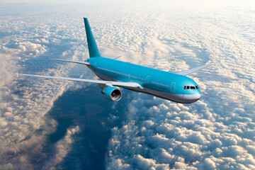 Blue passenger plane in flight. Airplane fly high above the clouds. Front view of aircraft.