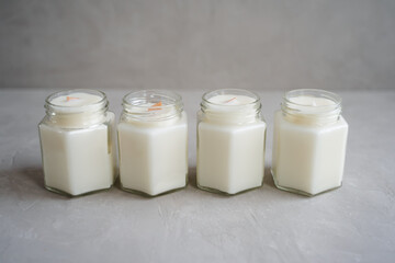 Candles made of natural soy wax in glass jars.