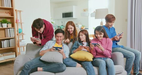 friends play phone games - Powered by Adobe