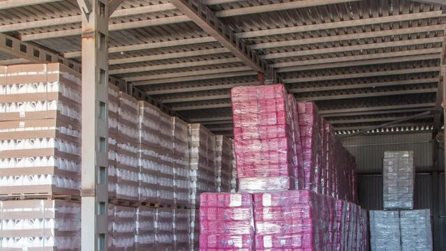 Forklift loader and cargo boxes storing at warehouse timelapse