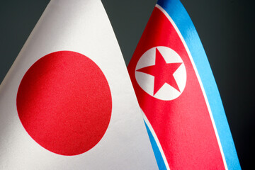 Close-up of the flags of Japan and North Korea.