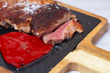 Grilled pork meat with piquillo peppers