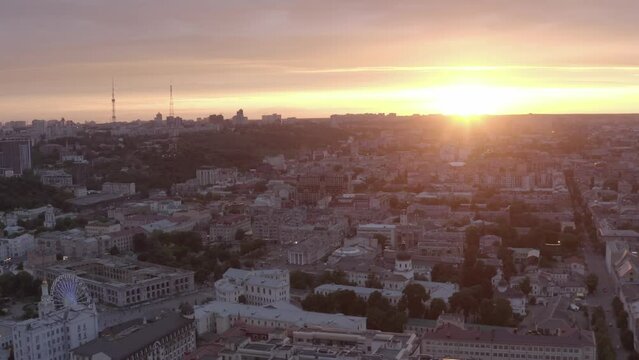 Podol is an old district of the city of Kyiv. Sunset. Summer. Roofs of houses. Aerial. Сity ​​skyline