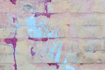 Background of old vintage dirty brick wall with peeling plaster and paint