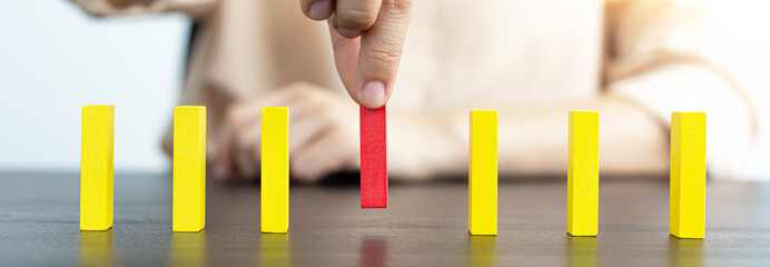 Strategies and risks of wooden games, .Close-up of business people gambling with investment risk,...