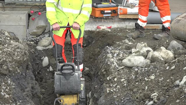 Tamping soil vibrating plate. tamping rammer. Construction Workflow. High quality 4k footage