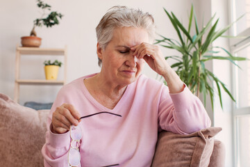 middle aged lady looking away sit alone at home feel anxious lonely, sad