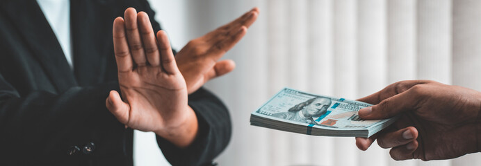 Businessmen give dollars to bribe employees in signing contracts to buy illegal land and real estate, Business fraud and social injustice, Anti Bribery and corruption concept.