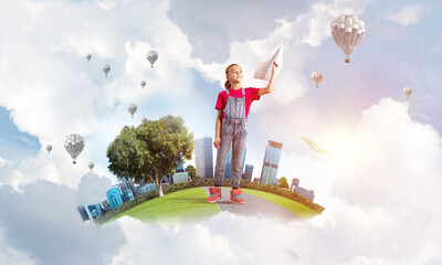 Concept of careless happy childhood with girl dreaming about future