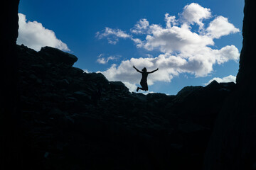 Silhouette in the mountain Torghatten - with jumping woman, Northern Norway,scandinavia,Europe