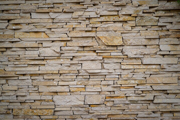 beige natural stone texture wall Seamless background.  sandstone