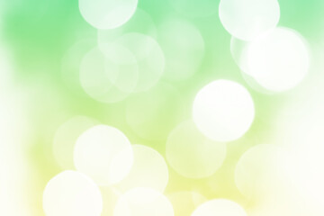 Summer green sparkling glitter bokeh background, abstract defocused lights texture