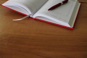 Office desk, workplace with notebook, pen. Business background.