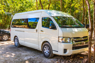 Van car in tropical natural jungle forest Puerto Aventuras Mexico.