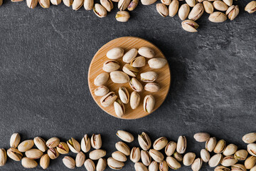 A bird's-eye view of a pistachio placed against an old tree