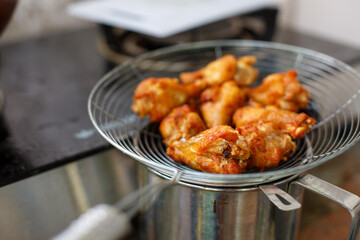 Fried chicken in deep fry outdoor