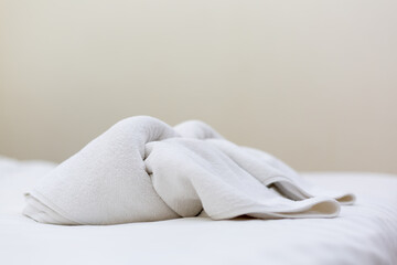 Fototapeta na wymiar Set of towels on comfortable Double bed in bedroom