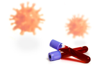 Against the background of flying coronavirus cells, two test tubes with a blood test.