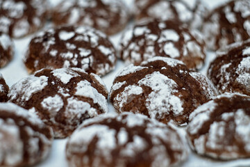 Cracked delicacies sprinkled with powdered sugar for Christmas.