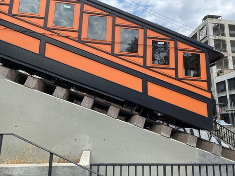 LOS ANGELES, CA, JUL 2021: side view orange rail carriage of historic Angel's Flight funicular railway in Downtown
