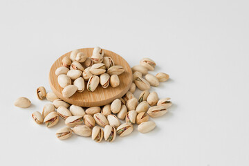 Pistachios nuts on white background. Healthy eating 