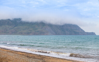 Rocky cape in the fog