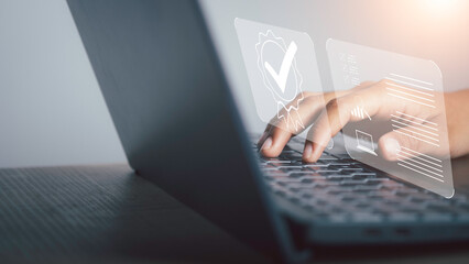 Businessman working on laptop with sign of Quality assurance, Guarantee, ISO certification and...